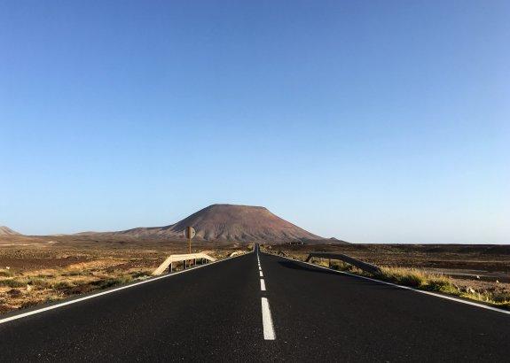 The open road leading to the ‘Montaña Roja’, a vertiginous remnant of the island’s fiery and violent creation.
