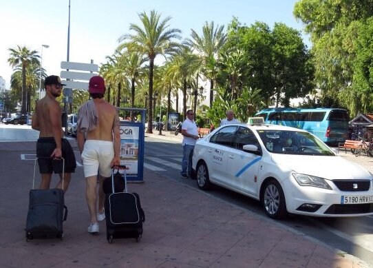 Shirtless tourists in Puerto Banús this week; fines could become more commonplace.