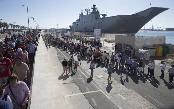 Hundreds line up on the Malaga quayside to see the 231-metre long vessel.