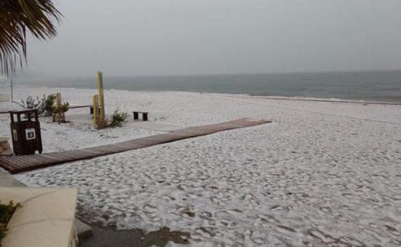 The beach in Fuengirola which seemed to be covered by snow.