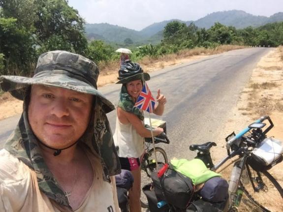 The pair on the road in Cambodia in 2016.