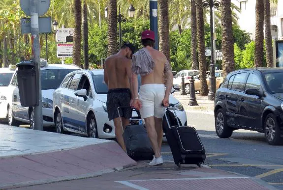 Shirtless visitors to Puerto Banús last summer caused local upset . 