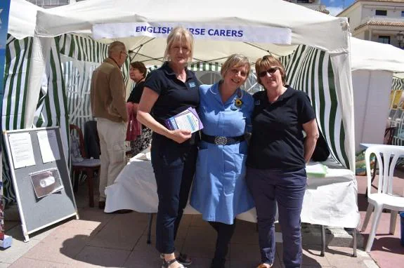 Liz Brown (centre and inset) with other carers at Nerja Residents' Day.