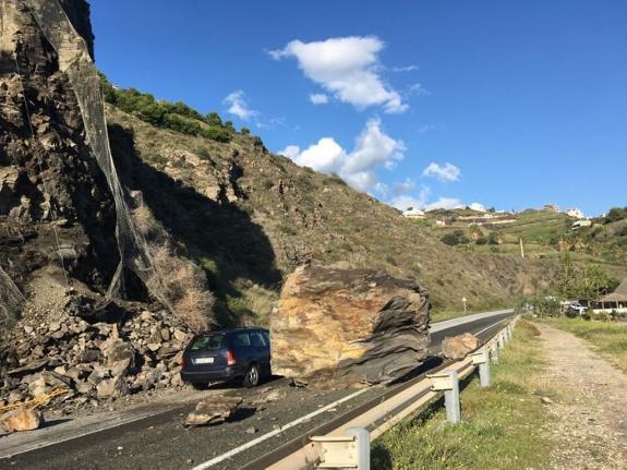 Cars continued to drive around the fallen rock until the road was officially closed. 