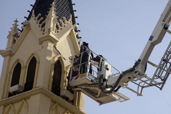 Repair work is carried out to a church tower in Melilla, damaged in the earthquake.