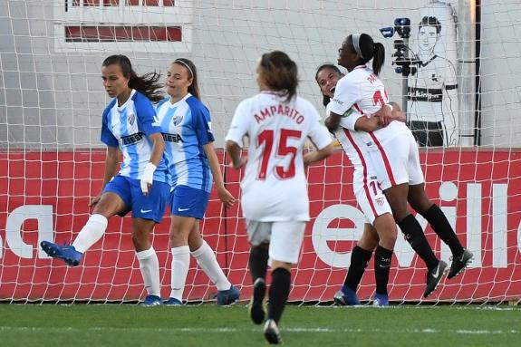 Raquel and Ruth react as Sevilla celebrate a goal.