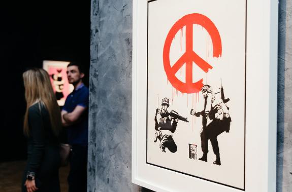 The exhibition includes iconic works by Banksy.