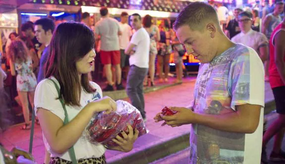 Condoms are distributed among tourists at a Spanish resort. 