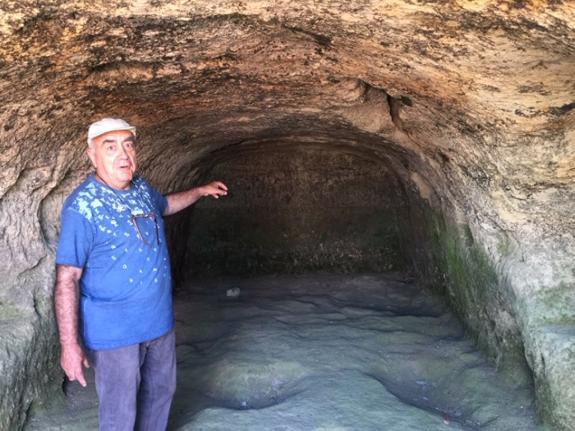 Retired archaeologist  Carlos Gozalbes,in the cave.