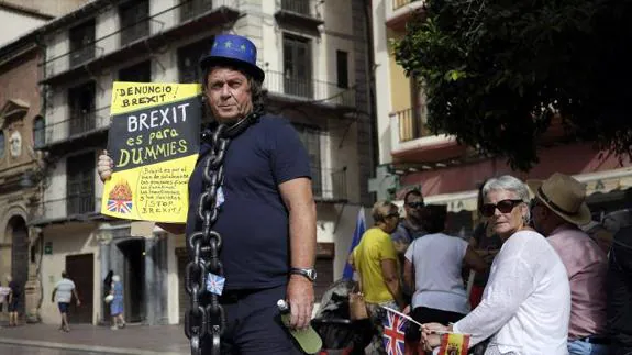 One of the protesters makes his point in Malaga on Sunday.