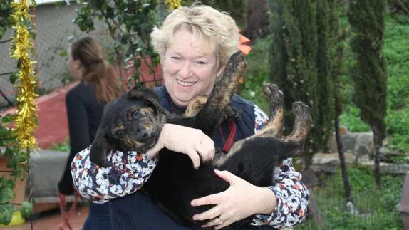 President of ACE Fabienne Paques with one of the dogs.