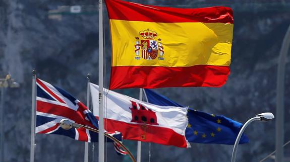 The Gibraltar flag among others at the border between Spain and the British territory.