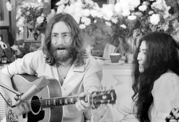 John Lennon, left, with wife Yoko Ono. 