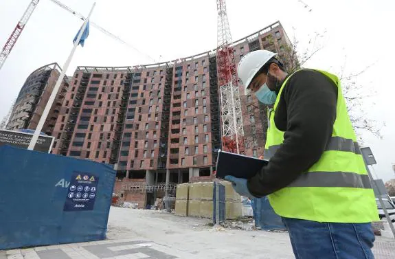 A worker wears a protective mask at a reopened construction site in Malaga. 