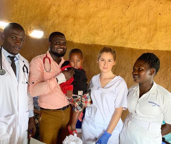 Elena Craven with Ugandan doctors and a nurse.  