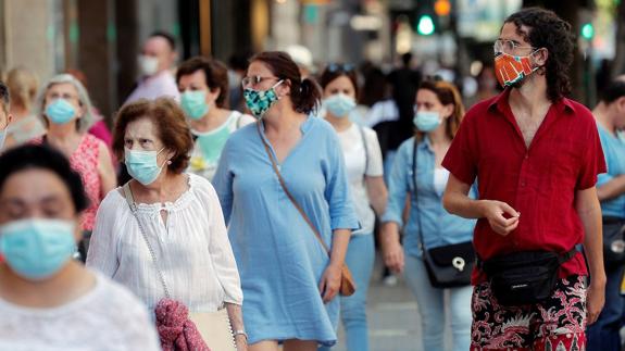 Face masks in the street will be normal in Spain for weeks to come.