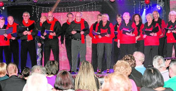 The popular TAPAS choir performing at an event prior to the coronavirus pandemic.