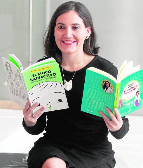Marián García, with two of her books.