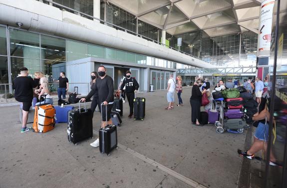 Passengers arrive at Malaga-Costa del Sol Airport. 