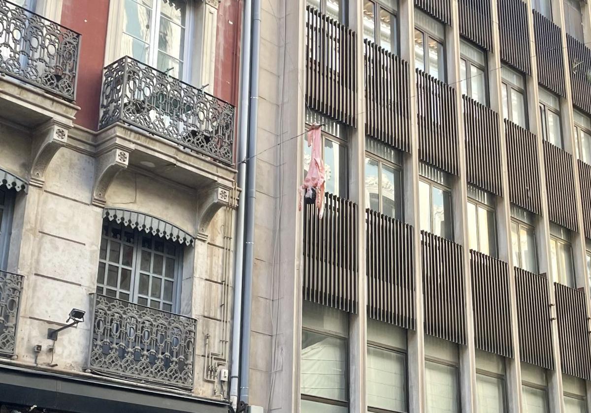 Inflatable Doll Hung Over Cables in Central Alicante Street