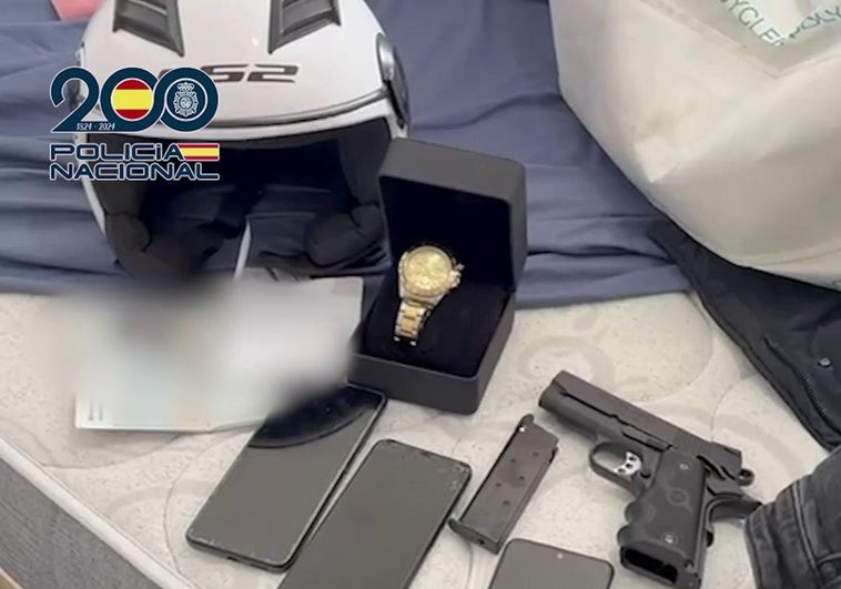 A firearm and a watch among the items seized by the National Police.