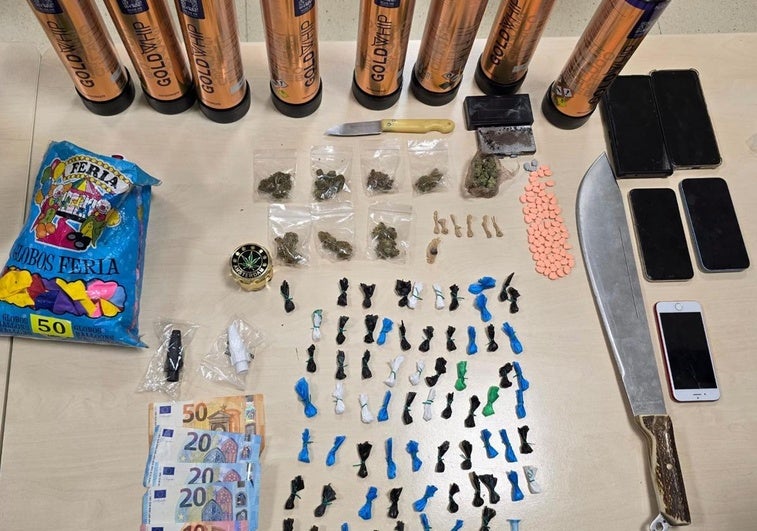 Drugs, weapons, mobile phones, and knives seized during the operation.