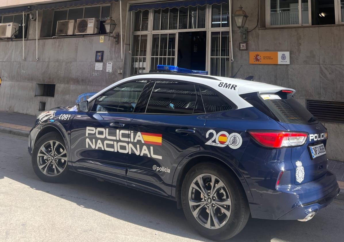 National Police patrol in front of the Benidorm Police Station.