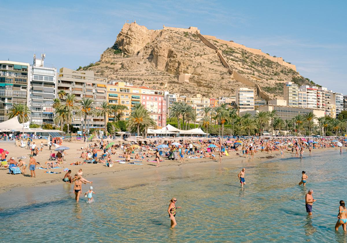 Beachgoers at Postiguet Beach.