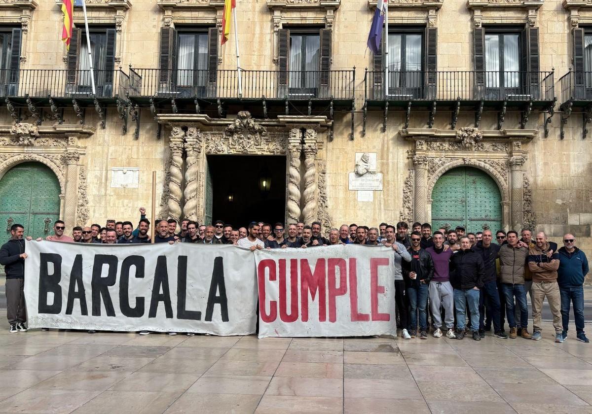 Firefighters gather in the Town Hall square.