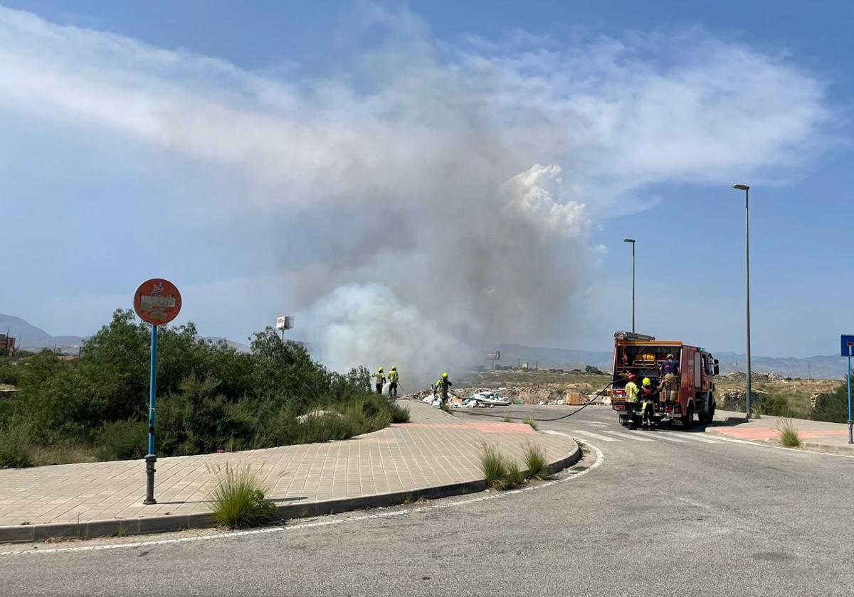 Firefighters working to extinguish the fire.