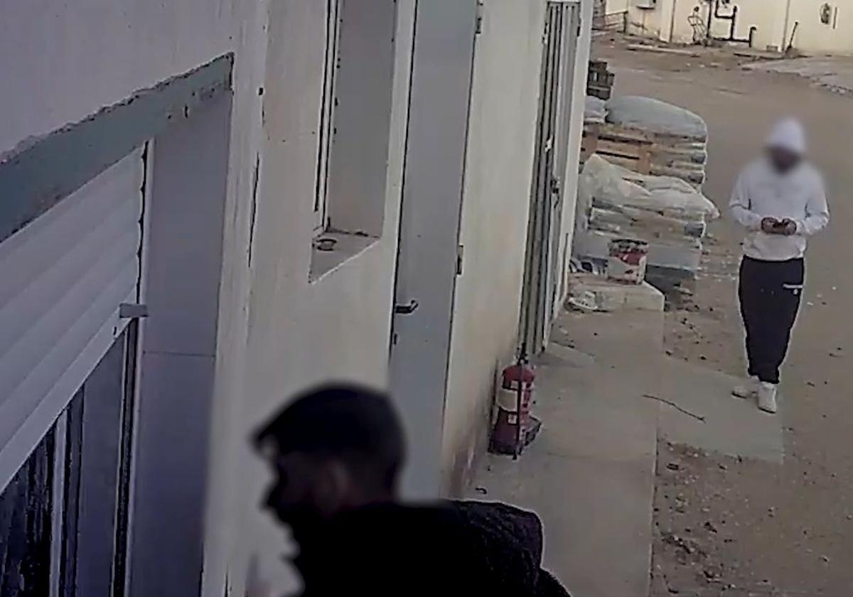 Security cameras capture the two thieves in action.