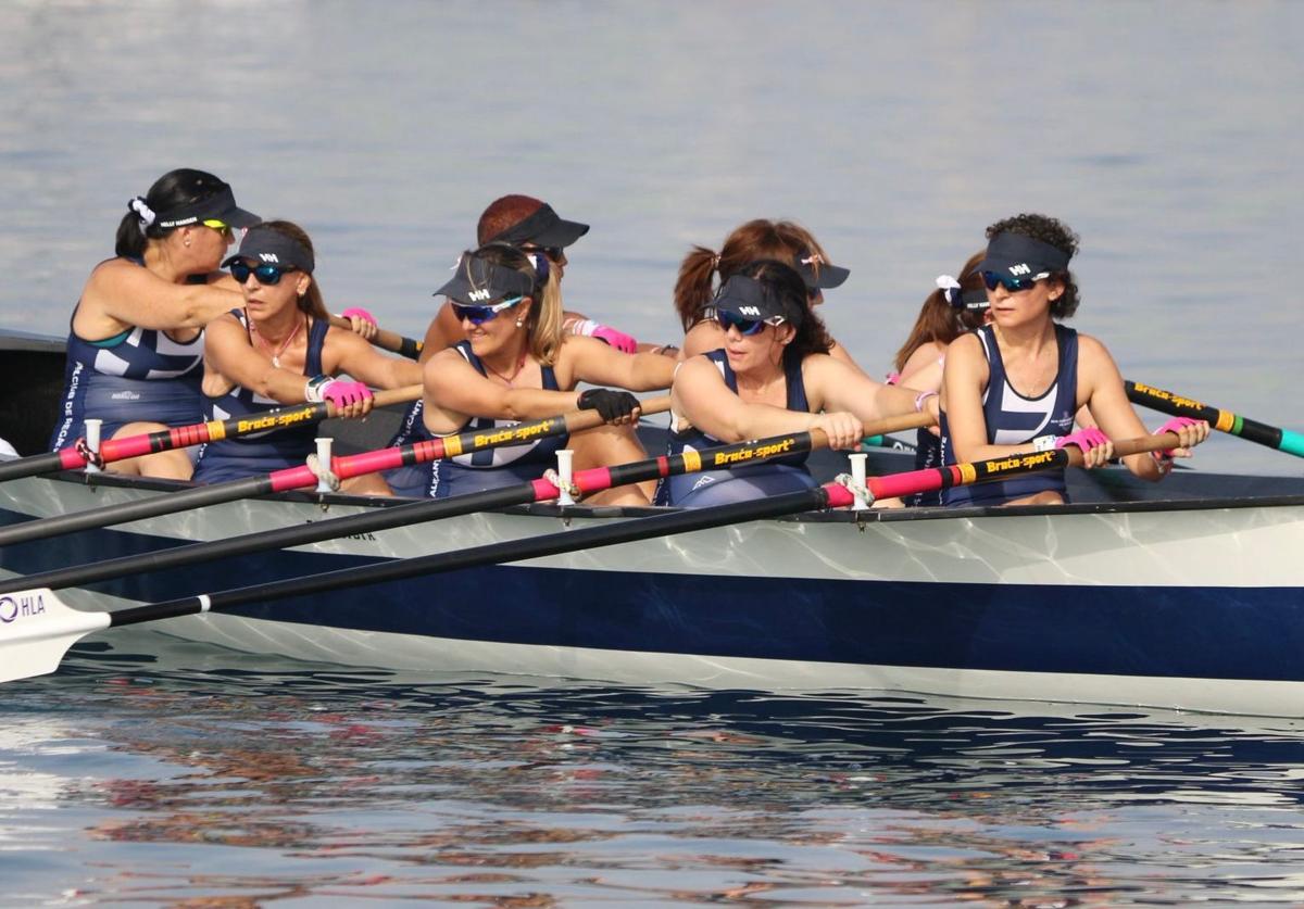 Women from the team rowing.