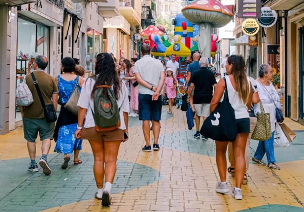 Tourists and pedestrians on 'Mushroom Street'.